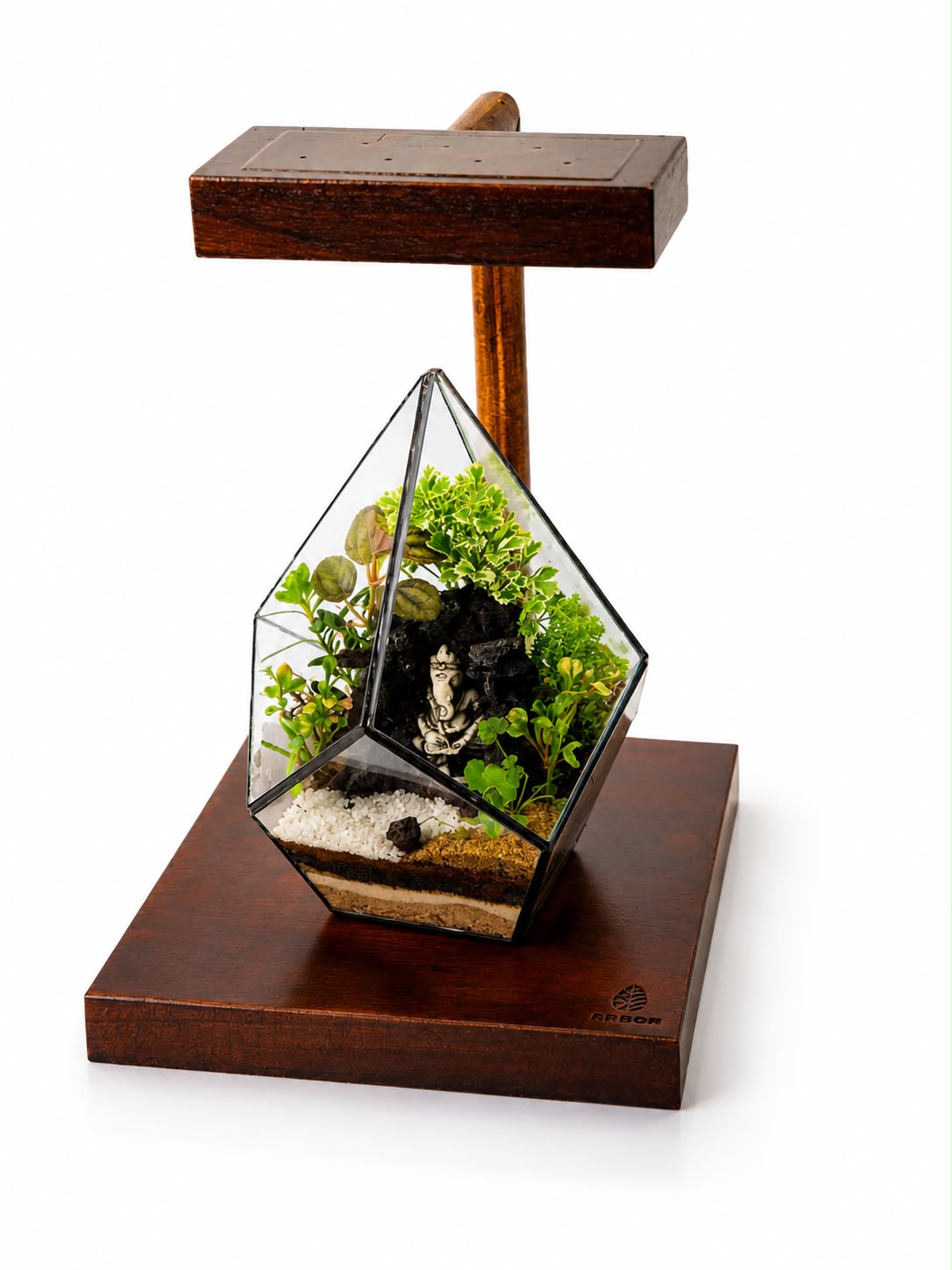 Faceted geometric terrarium with figurine detail